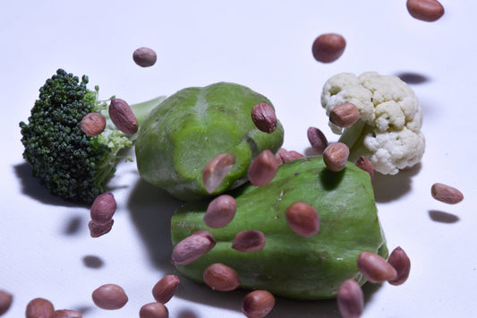 green and white fruit on white surface
