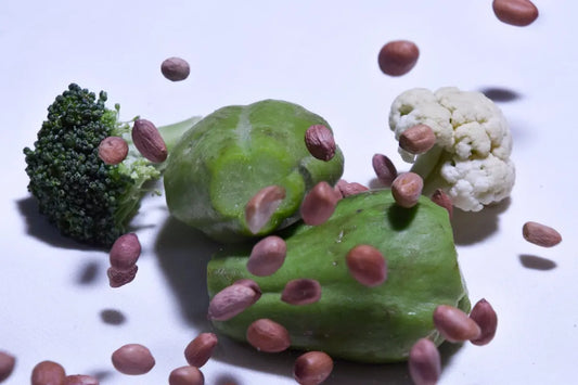 green and white fruit on white surface