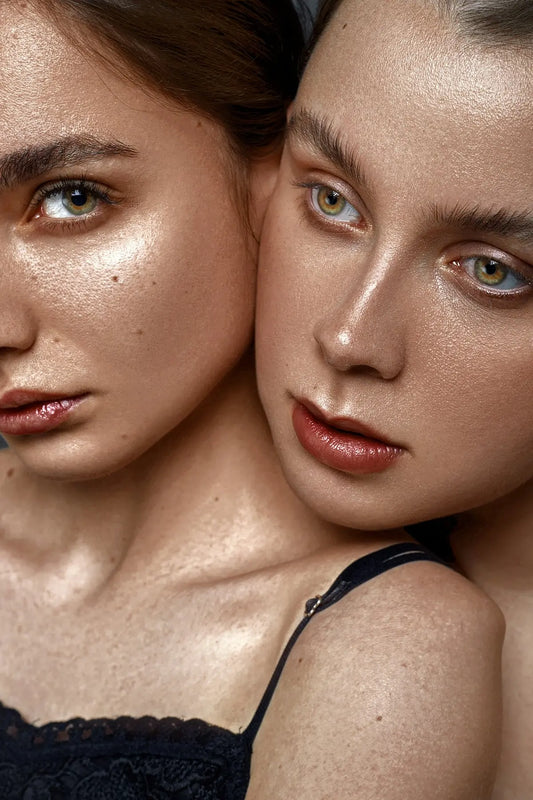 two beautiful young women posing for a picture
