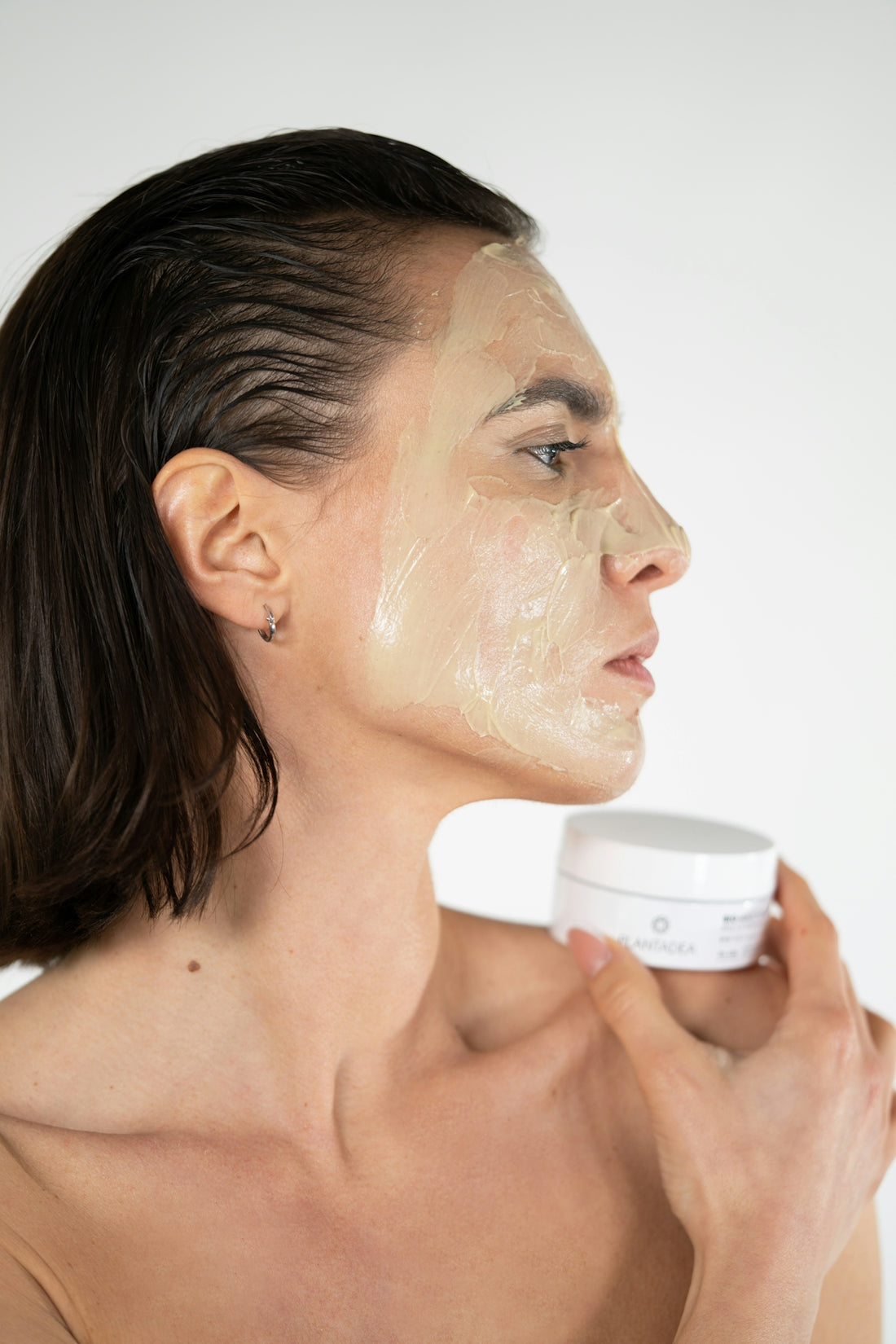 a woman with a facial mask on her face