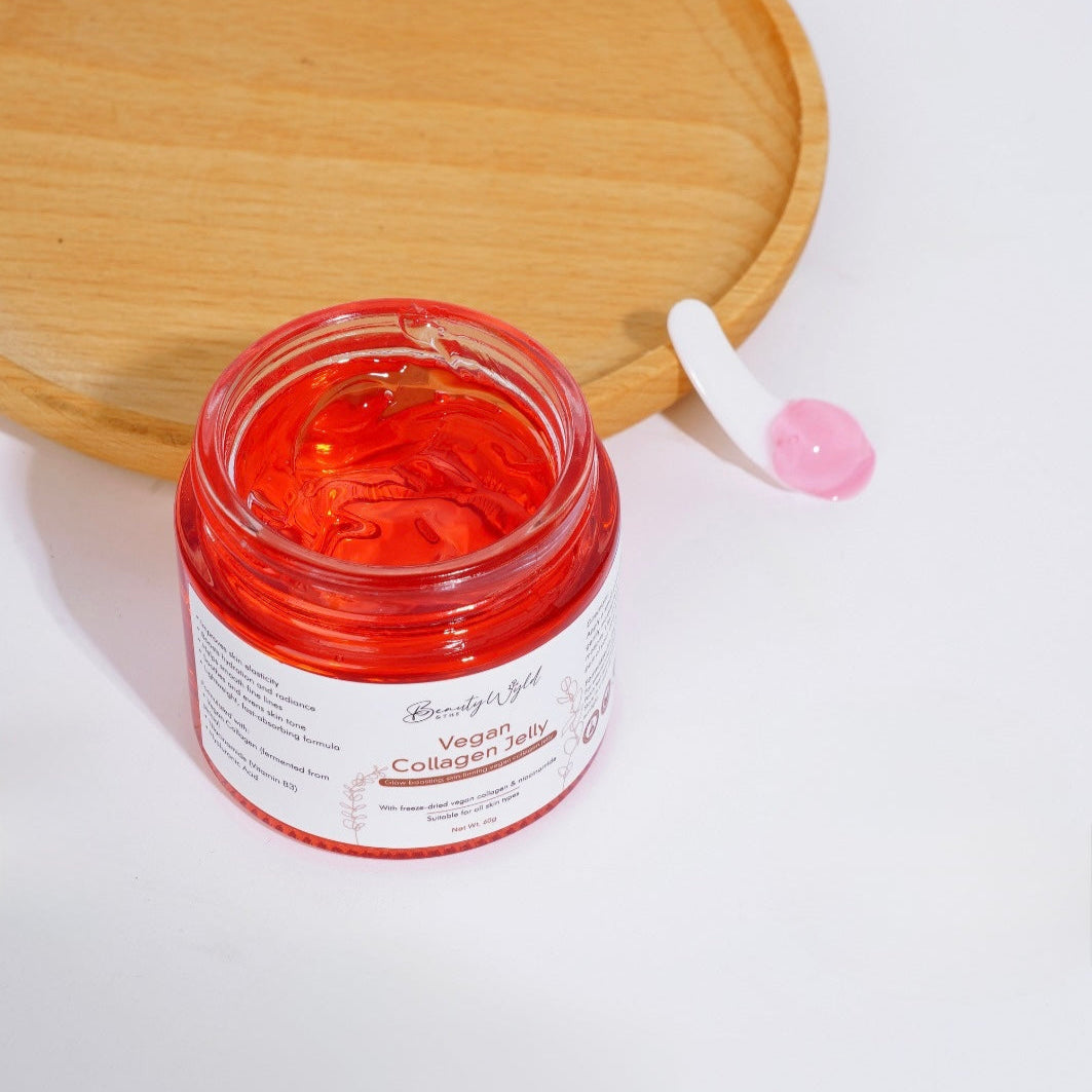 Vegan Collagen Jelly Cream on a white surface with the lid off showing the jelly texture of the contents