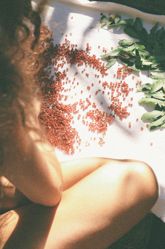 woman in white and red floral dress