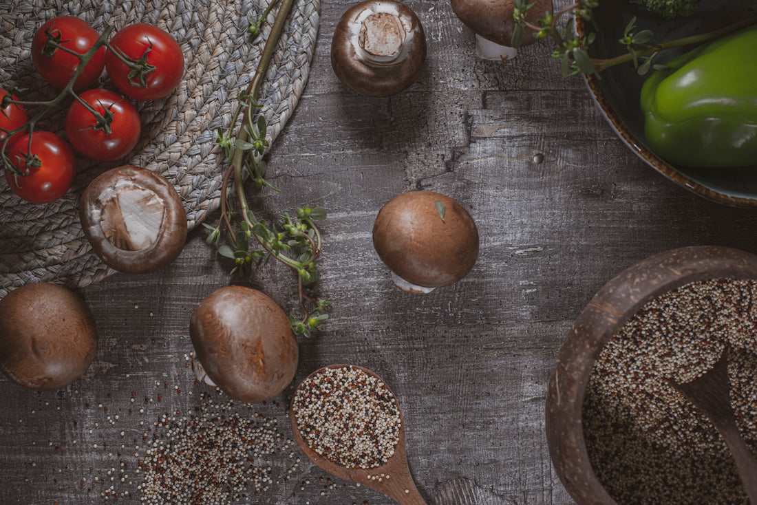 red cherry fruit beside brown wooden round bowl