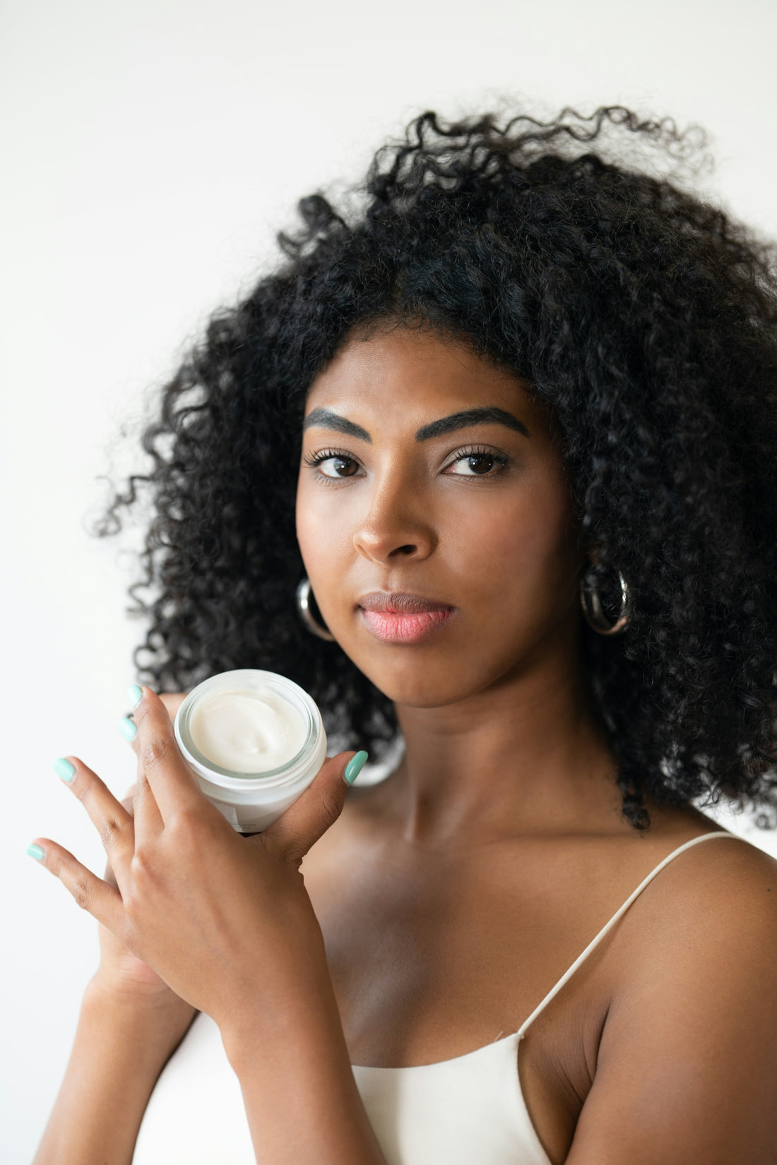 a woman holding a cup