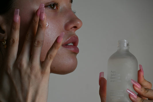 a person holding a bottle