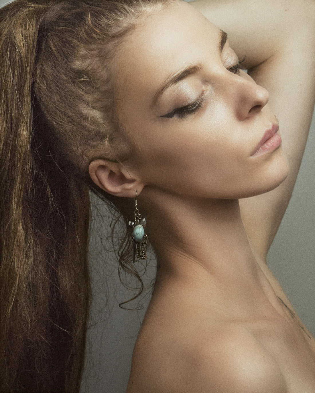 a woman with her hair in a ponytail