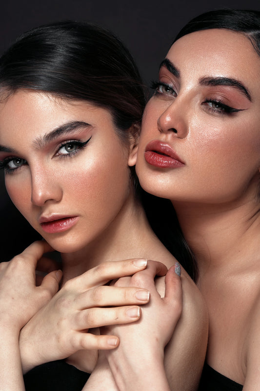 two beautiful young women posing for a picture