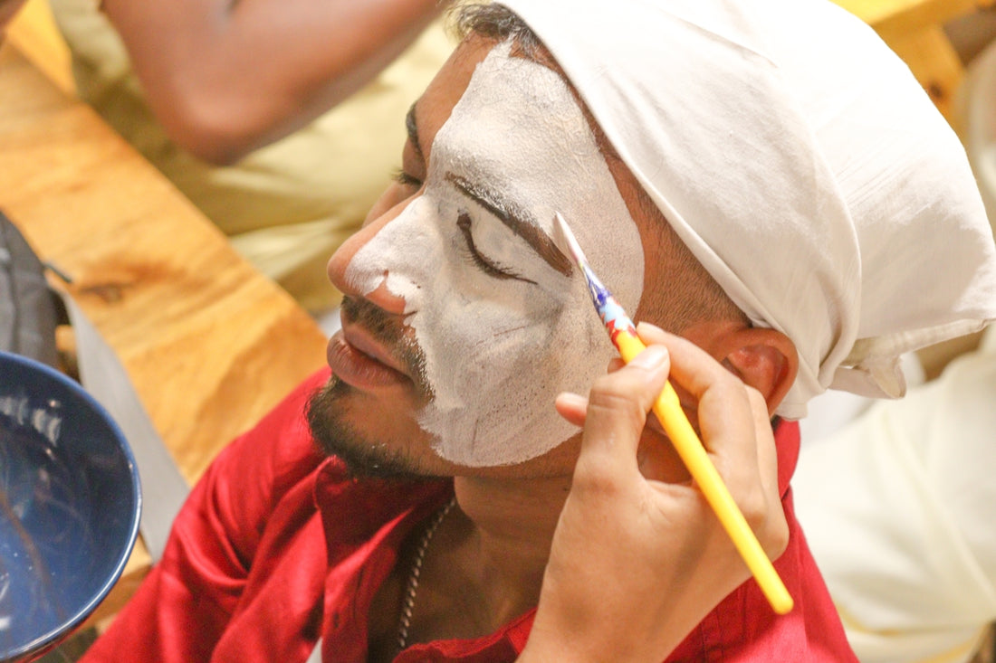 a man is shaving his face with a yellow toothbrush