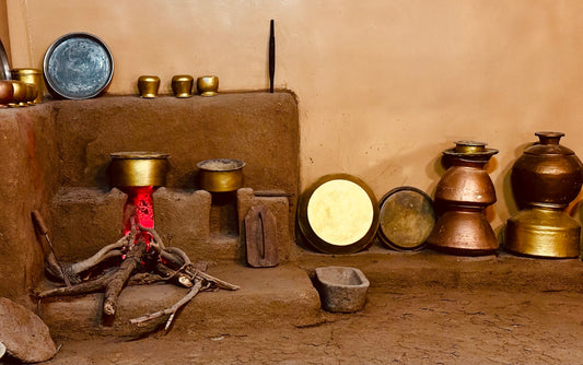 a group of pots sitting on top of a stone floor