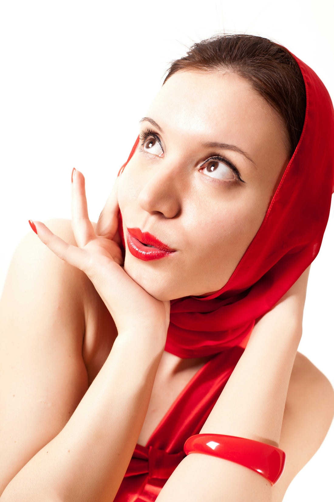 A woman with a red scarf on her head