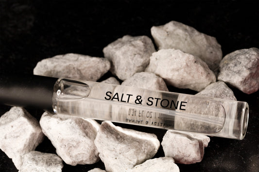 Salt & stone perfume rollerball surrounded by rocks
