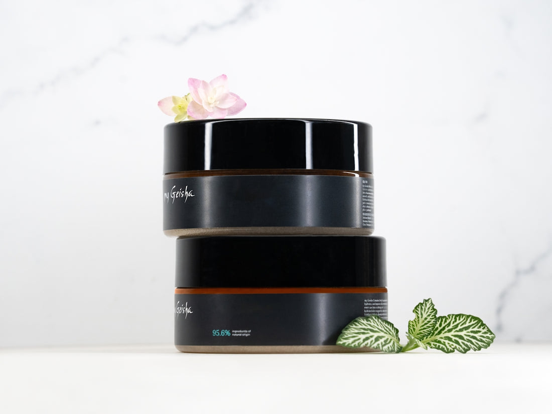 Two cosmetic jars stacked with plants and plants