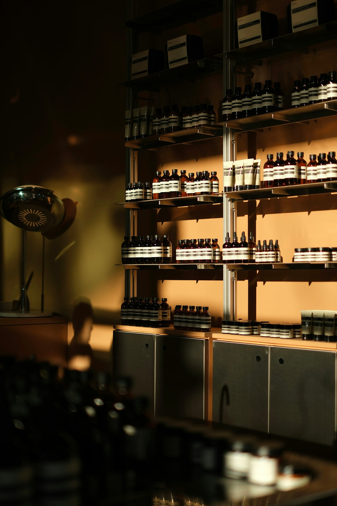 Bottles of skincare products displayed on shelves.