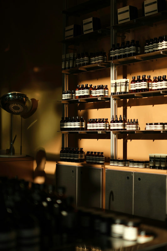 Bottles of skincare products displayed on shelves.