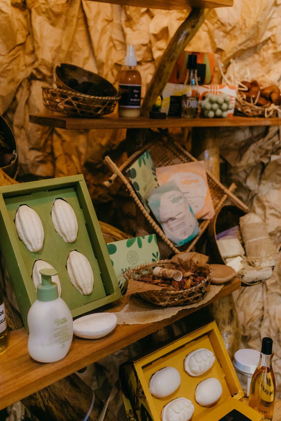 Handmade soaps and natural beauty products displayed on wooden shelves.