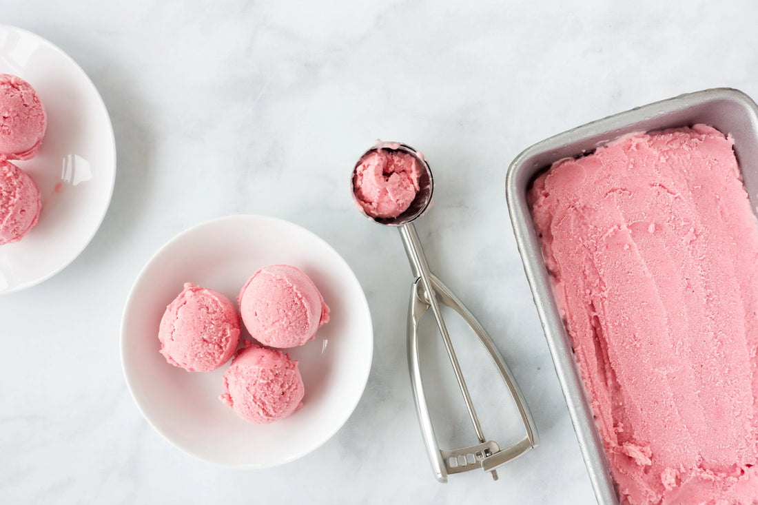 Healthy vegan strawberry ice cream in a bowl on a white background to help increase collagen production and reduce wrinkles 