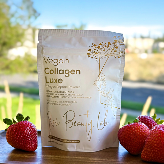 Collagen peptide package with strawberries on a wooden surface outdoors