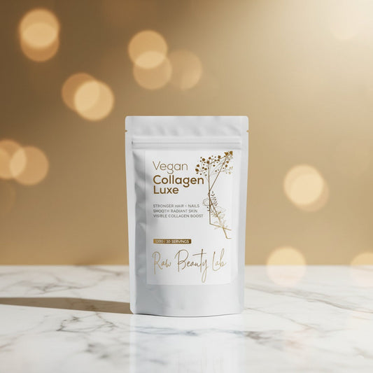 Vegan Collagen Luxe package on a marble surface with a blurred gold background