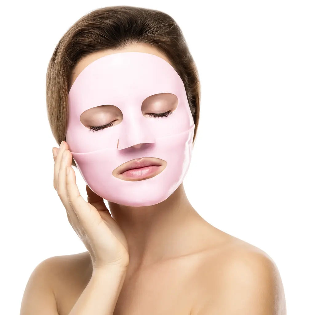 A woman wearing a vegan collagen face mask from the Beauty & The Wyld collection, by Raw Beauty Lab