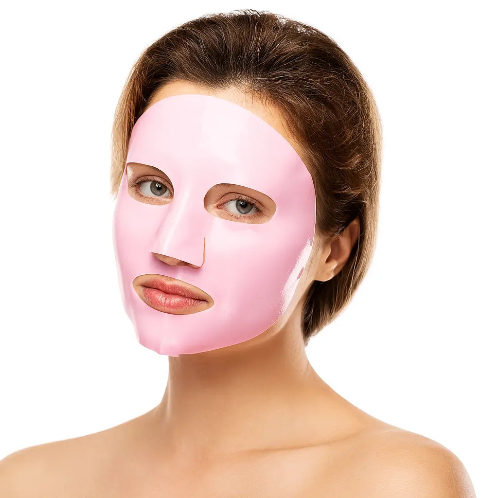 A woman looking into the camera wearing a vegan collagen face mask from the Beauty and the Wyld collection by Raw Beauty Lab