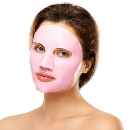 A woman looking into the camera wearing a vegan collagen face mask from the Beauty and the Wyld collection by Raw Beauty Lab