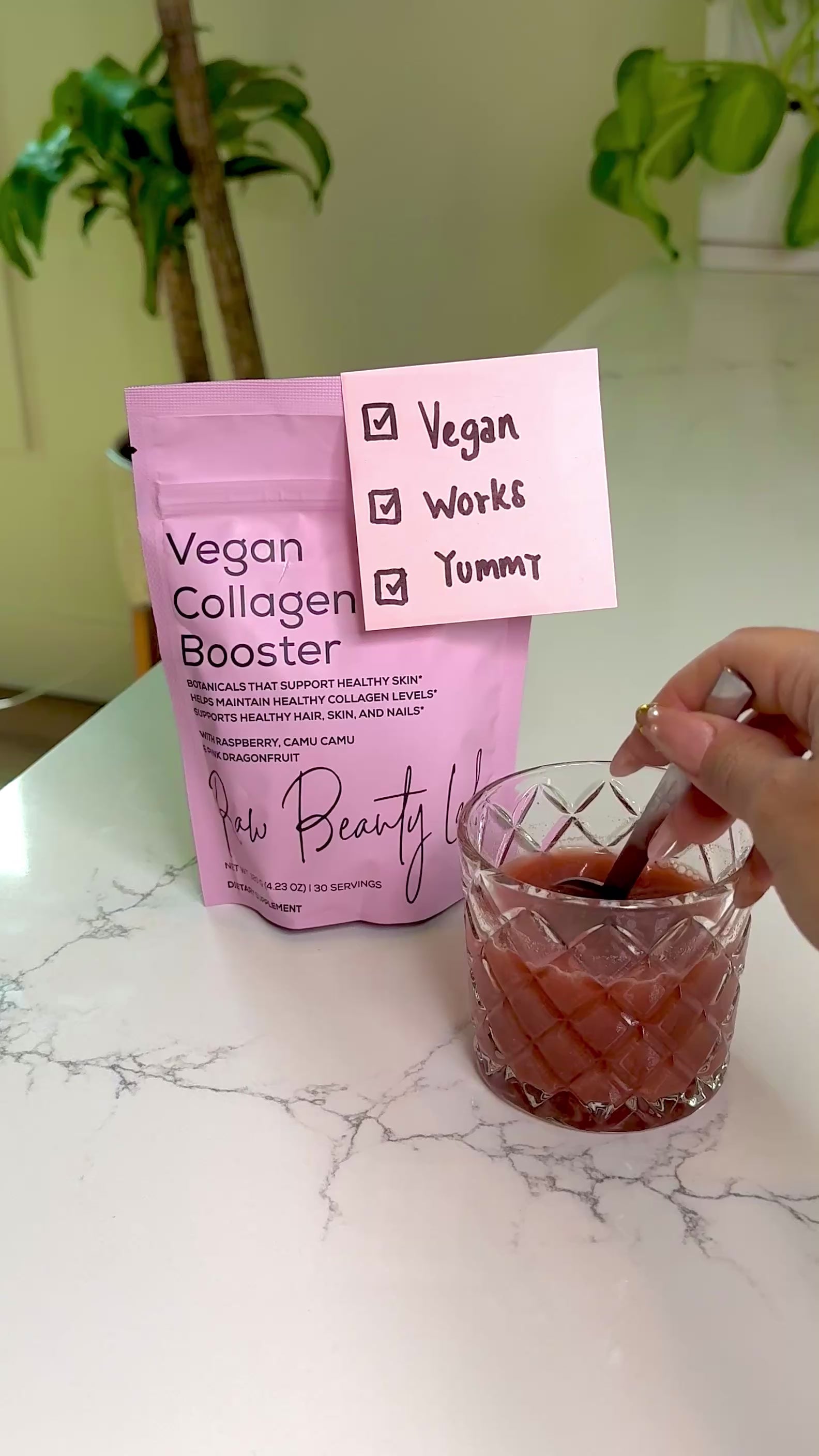 Video of a collagen booster being stirred in a glass