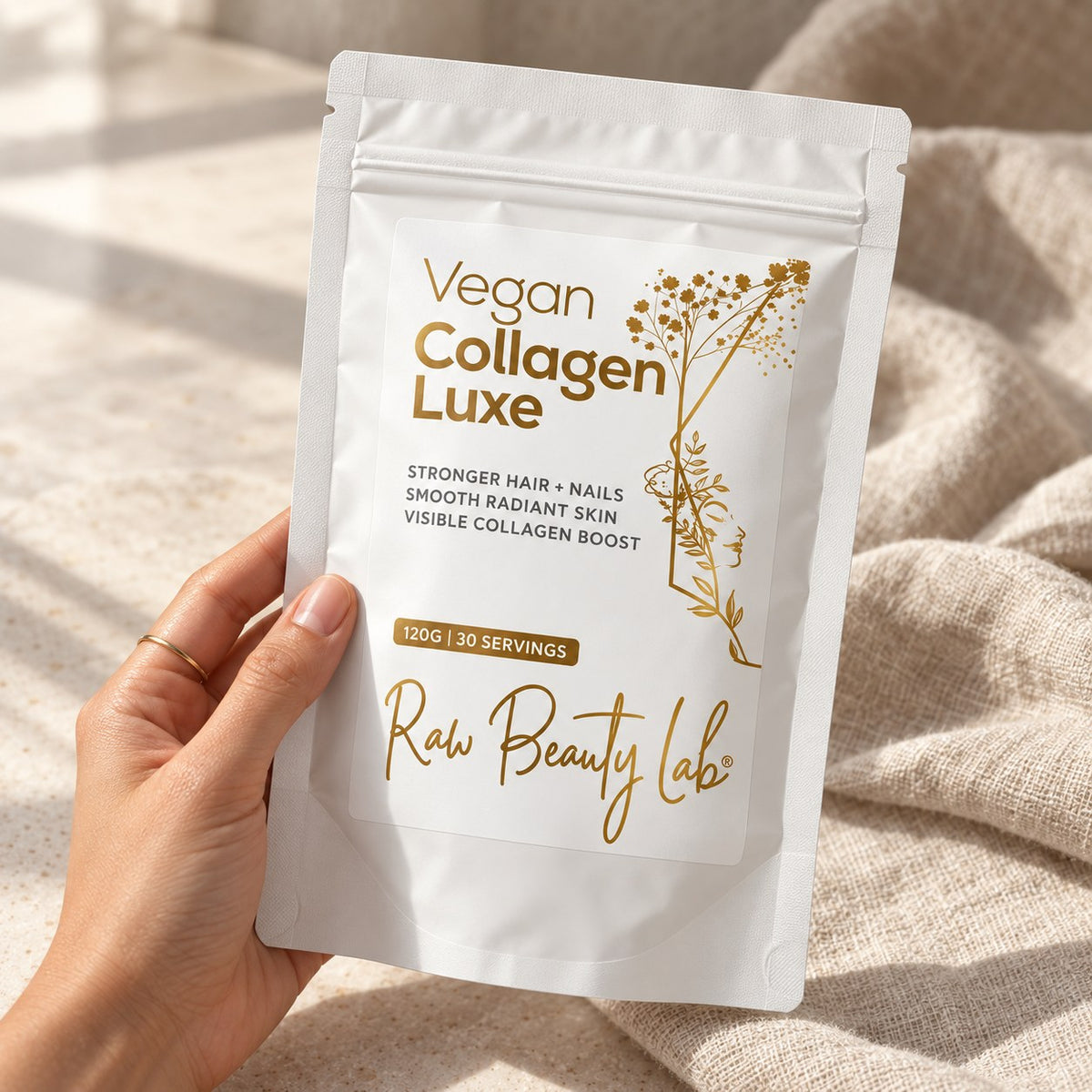 Hand holding the Vegan Collagen Luxe pouch