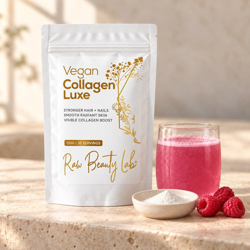 Vegan Collagen Luxe pouch beside a pink drink, a dish of white powder and raspberries